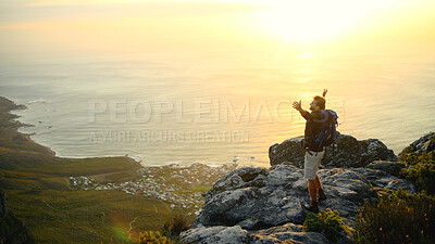 Buy stock photo Ocean, mountains and man with arms raised, nature and excited with fitness, challenge or break. Environment, hiker and person with happiness, exercise or seaside with energy, celebrate or achievement