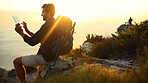 Man, hiking and mountain at sunset with tablet, ocean or click for search on digital map in summer. Person, perspective and touchscreen by sea, cliff and app for direction with trekking in Greece