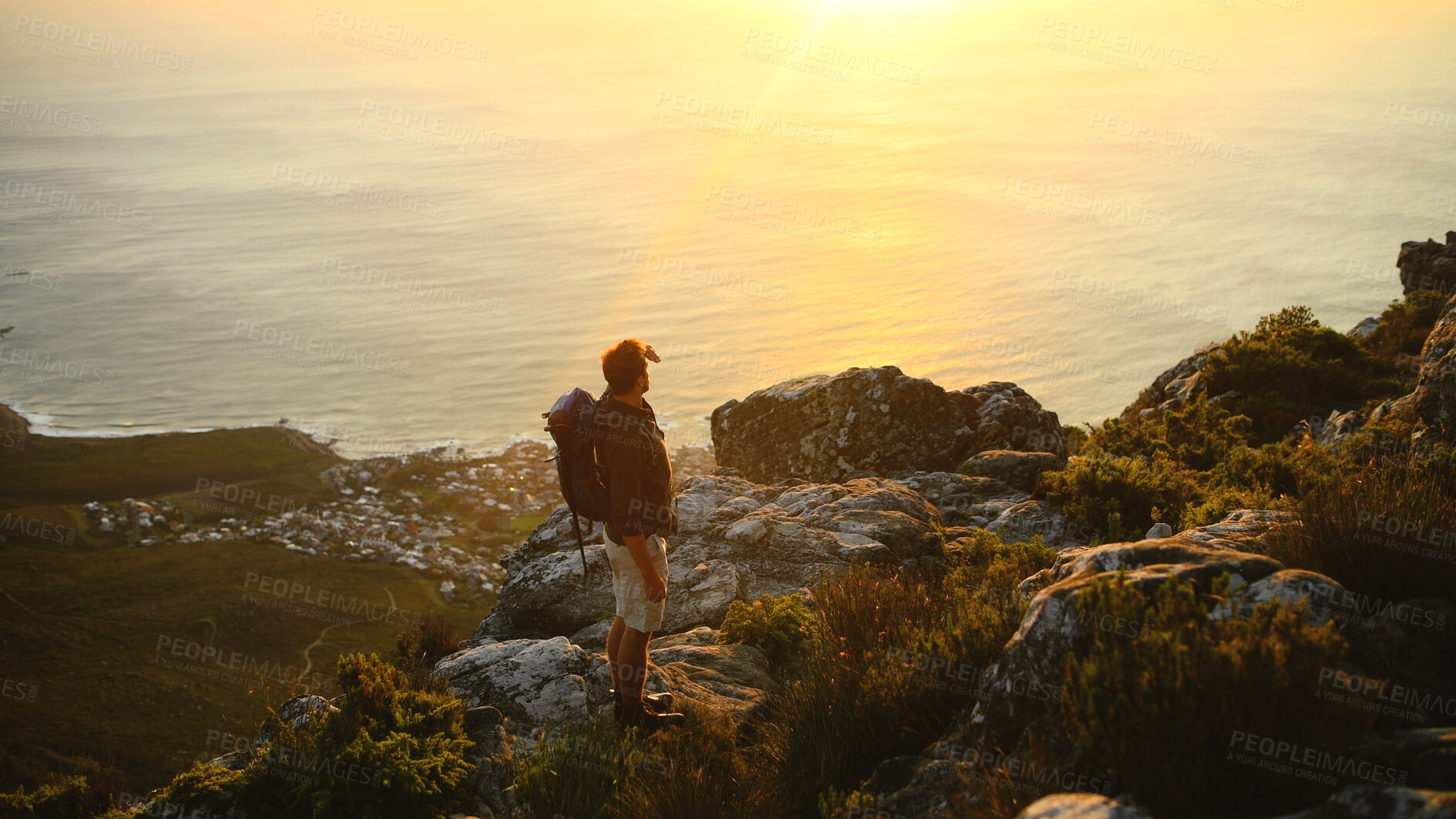 Buy stock photo Hiking, sunrise or man with view of mountain for travel adventure, sightseeing or explore ocean. Tourist, back or person with backpack for trekking break, backpacker journey or scenery at destination