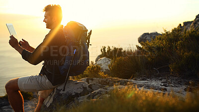 Buy stock photo Man, hiking and mountain with search on with tablet, ocean or sunset with digital map in summer. Person, scroll and touchscreen by sea, cliff and application for direction with trekking in Spain