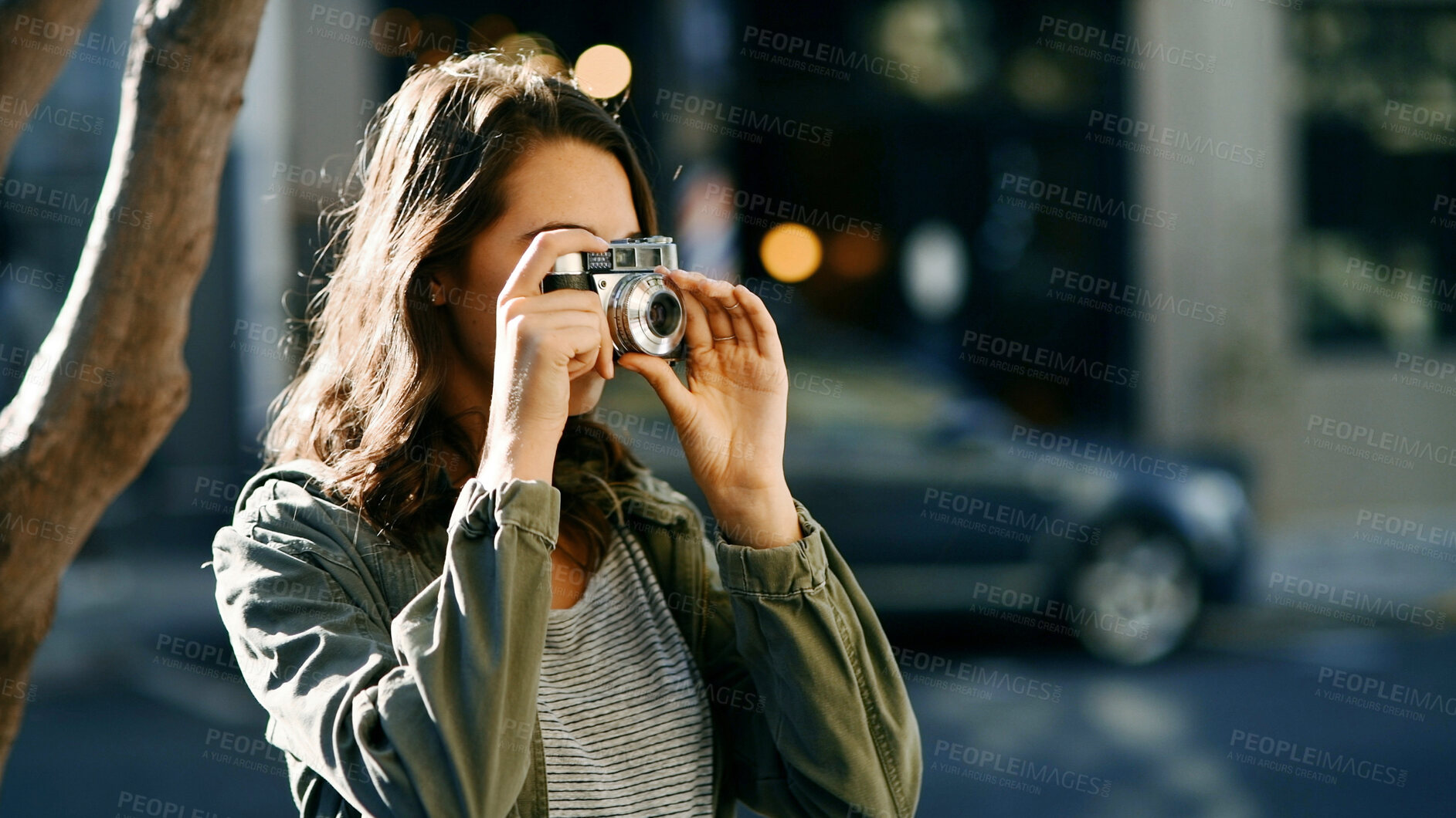 Buy stock photo Camera, travel and woman in city for sightseeing on vacation, getaway or weekend trip with photography. Equipment, tourist and female person capturing view for social media in urban town for holiday.