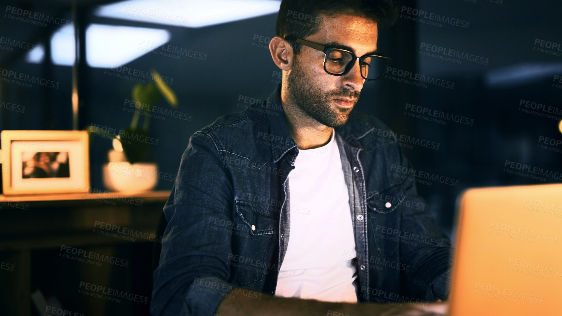 Buy stock photo Night, journalist and man on laptop for writing draft, update and deadline for news article. Project, journalism or creative writer in overtime for blog website, story research and online publication