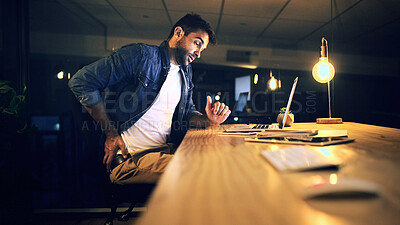 Buy stock photo Back pain, night and man in office with injury for working late on project, deadline and software. Professional, IT technician or overtime on laptop with stress, strain and muscle fatigue for posture