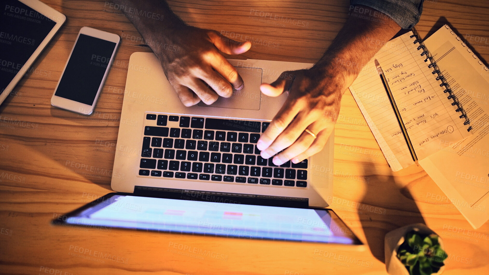 Buy stock photo Above, night and man with laptop, hands and typing with email for creative project. Closeup, person and writer with computer, notes and feedback for proposal, news report and proofreading article
