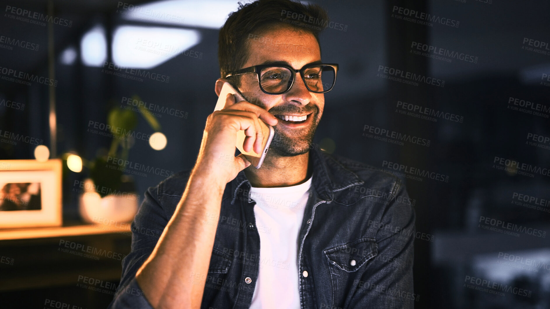 Buy stock photo Phone call, smile and businessman in night office for research, copywriting deadline or project. Creative worker, communication and editor with overtime, report or update for news article and space