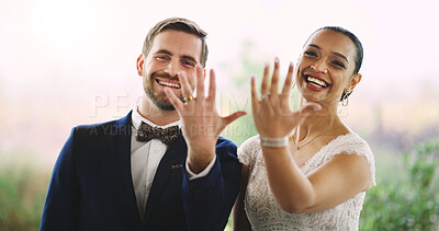 Buy stock photo Hands, wedding rings and portrait of couple with marriage, bonding and connection together at event. Happy, love and bride with groom at romance ceremony with jewelry for loyalty, trust or commitment