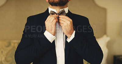 Buy stock photo Wedding, fashion and hands of man with bow tie getting ready for event, ceremony and celebrate. Marriage, preparation and groom dressing in home with smart clothes, formal suit and classy style