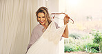 Happy woman, bride and hanger with wedding dress for fashion, marriage or ceremony preparation. Female person, wife or clothing tradition with smile, garment or apparel for engagement or commitment