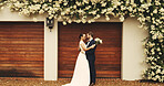 Wedding, celebration and couple with hug outdoor for marriage commitment, milestone and loyalty. Relationship, happy people and embrace by home for ceremony, romance and union of love with promise