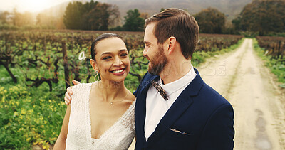 Buy stock photo Wedding, smile and hug with couple in nature for celebration, support and love. Marriage ceremony, partner and commitment with man and woman walking in countryside for romance and event