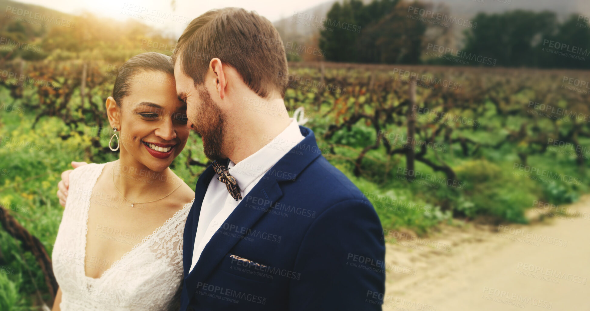 Buy stock photo Forehead, bride and love for groom, outdoor or commitment for couple in nature, marriage or embrace. Happy, man and bonding with woman on wedding day, together and smile for ceremony, hug and romance