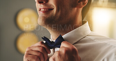 Buy stock photo Wedding, hands and groom getting ready with bow tie for marriage, ceremony and commitment. Happy, man and dressing in home with formal fashion for celebration, special day and preparation for event