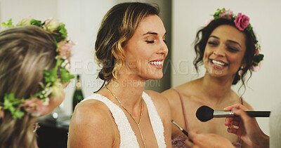 Buy stock photo Bride, bridesmaids and women with makeup for beauty with brush, laugh and support in home. Bridal party, cosmetics and friends together for celebration, getting ready and conversation on wedding day