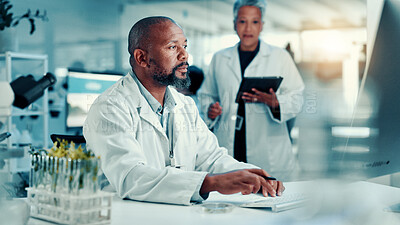 Buy stock photo Computer, healthcare and science with black man in laboratory for online development or research. Innovation, medical and typing with scientist at desk for breakthrough, clinical trial or experiment