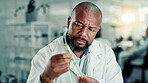 Black man, scientist and leaves at lab with tube for growth analysis with medical research for breakthrough. African person, biochemistry and test for medicine development with organic pharma drugs