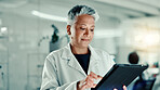 Woman, scientist and reading on tablet in lab for medical research, gene update and experiment. Mature person, digital and gmo for cells study, review report and virus information for vaccine results