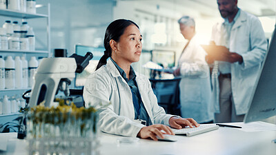 Buy stock photo Computer, medical and science with woman in laboratory for online development or research. Biology, healthcare and innovation with scientist at desk for breakthrough, clinical trial or experiment