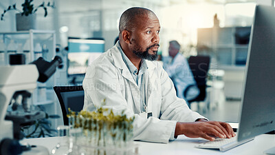 Buy stock photo Computer, medical and science with black man in laboratory for online development or research. Healthcare, innovation and typing with scientist at desk for breakthrough, clinical trial or experiment