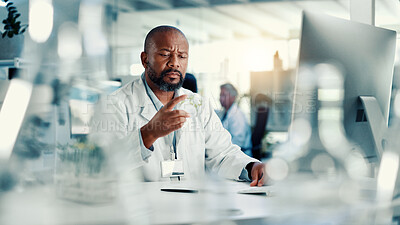 Buy stock photo Man, petri dish and leaves by computer in lab with thinking, review and results for medical research. Mature person, scientist and biochemistry for seedling, plants or pharma development with study