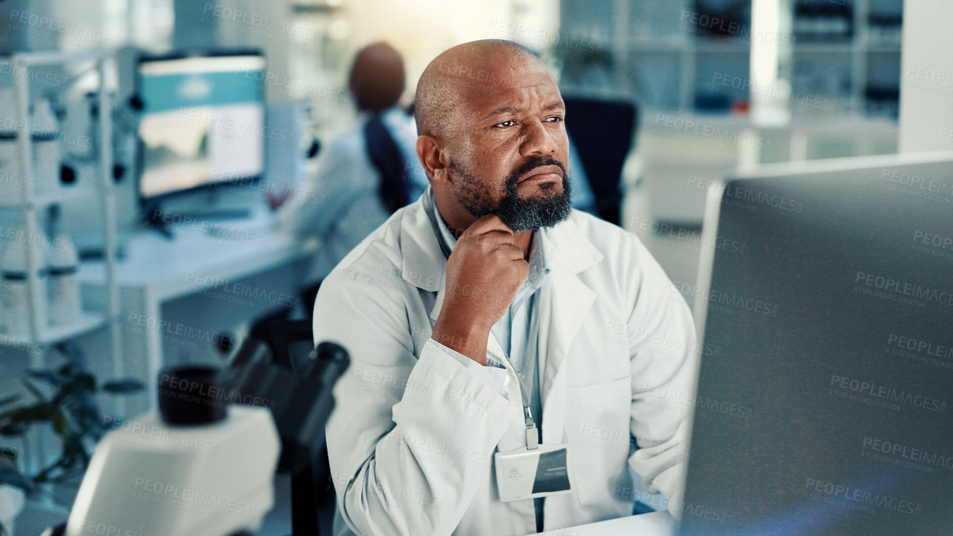 Buy stock photo Computer, science and solution with black man in laboratory for medical development or research. Healthcare, problem solving and thinking with scientist at desk for breakthrough or innovation