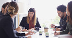 Collaboration, meeting and notes with business people in boardroom for discussion or planning. Corporate, teamwork and writing with employee group in office together for professional workshop
