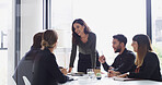 Team, female manager and meeting in conference room for financial planning, business and strategy. Group, discussion and woman with feedback or ideas for investment collaboration at finance firm