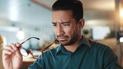 Buy stock photo Man, glasses and vision strain in office for wrong prescription, bad eyesight and lens mistake. Male person, squinting and check frame for dirty eyewear, optical challenge and impairment issues 