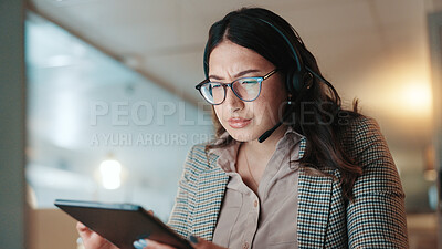 Buy stock photo Headset, reading and tablet with woman in call center for consulting, feedback or support at night. Communication, information and problem solving with person in customer service for evening help