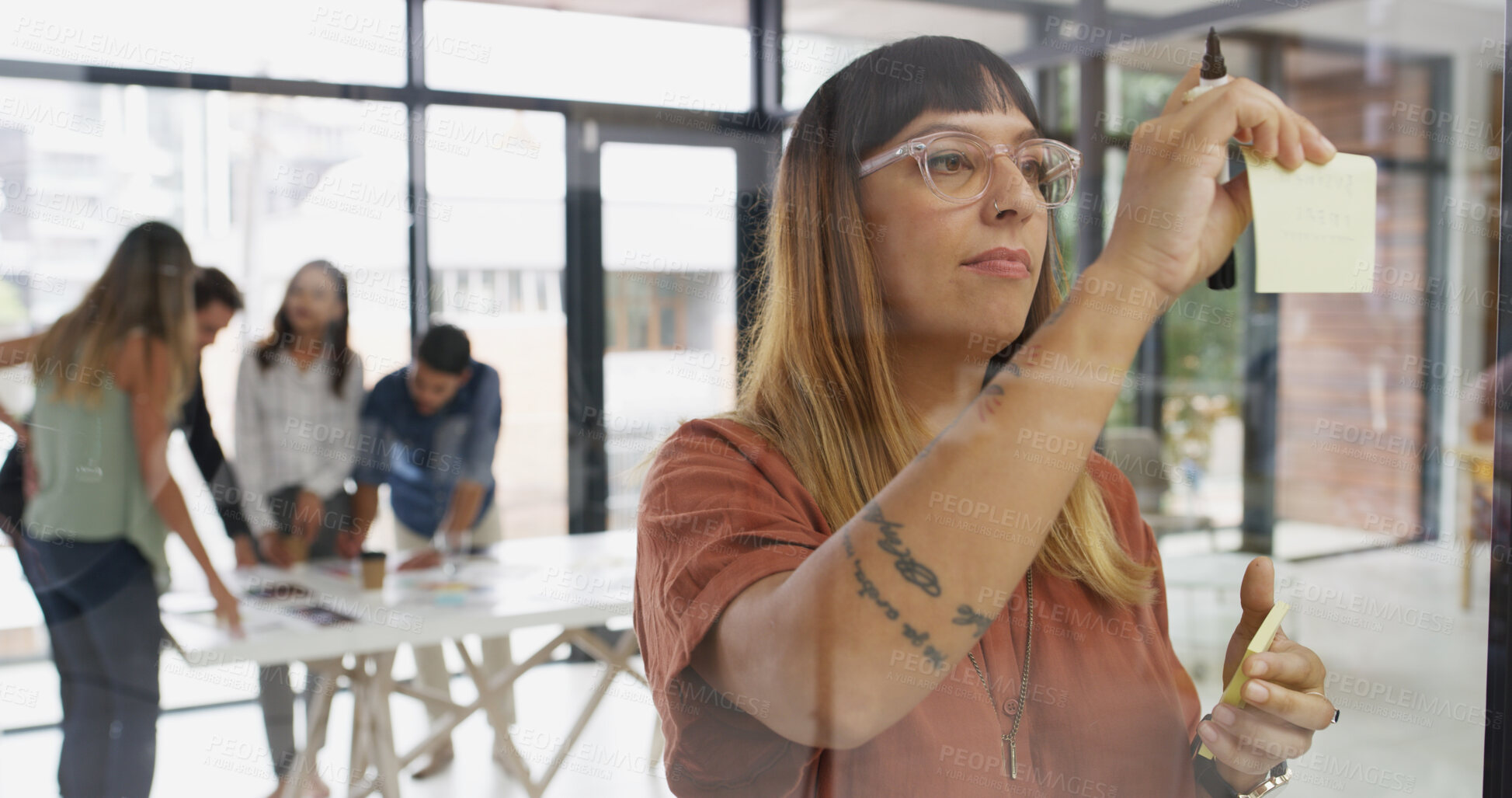Buy stock photo Woman, sticky note and planning by glass at startup, insight or review for project management in office. Person, paper and mindmap with solution, idea or perspective with moodboard at creative agency