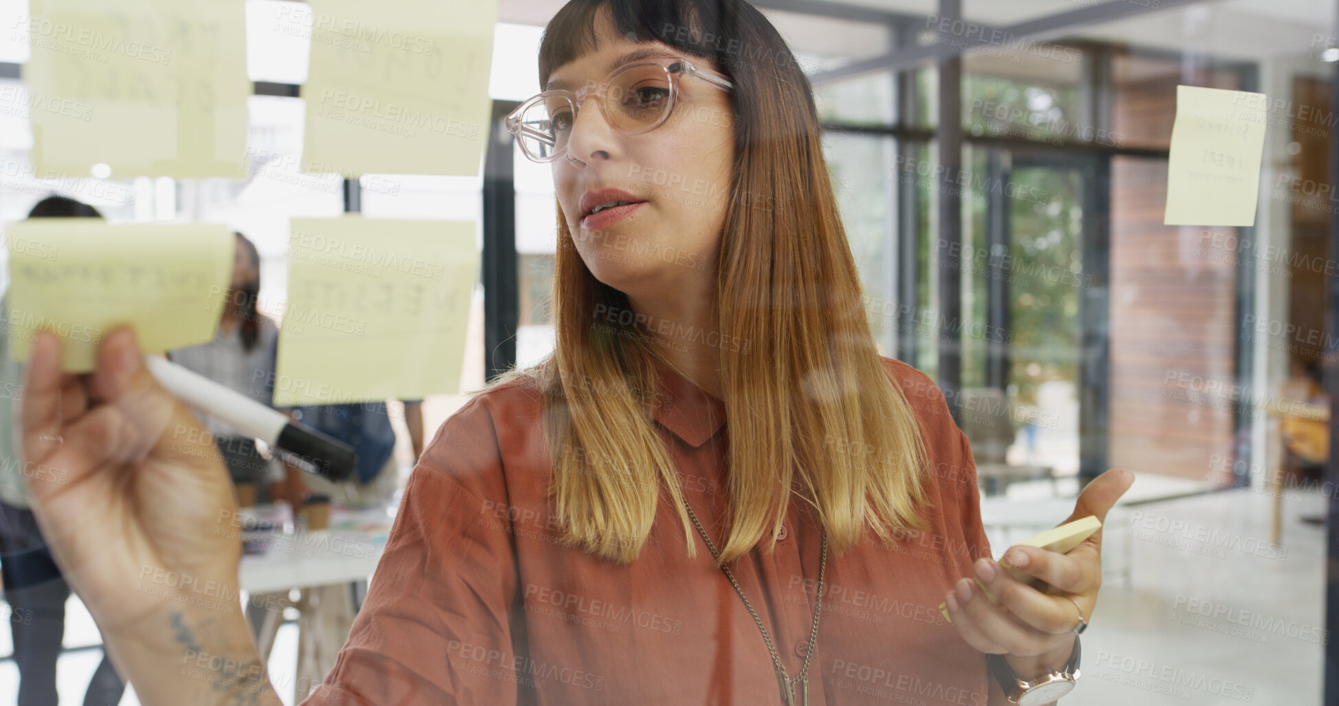 Buy stock photo Office, businesswoman and sticky note on glass wall for ideas, strategy and brainstorming in agency.  Workplace, female person and creative writer with moodboard for information, planning and startup