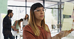 Woman, sticky note and planning by window at office, idea or review for project management at startup. Person, paper and mindmap with glass, task or perspective with moodboard at creative agency