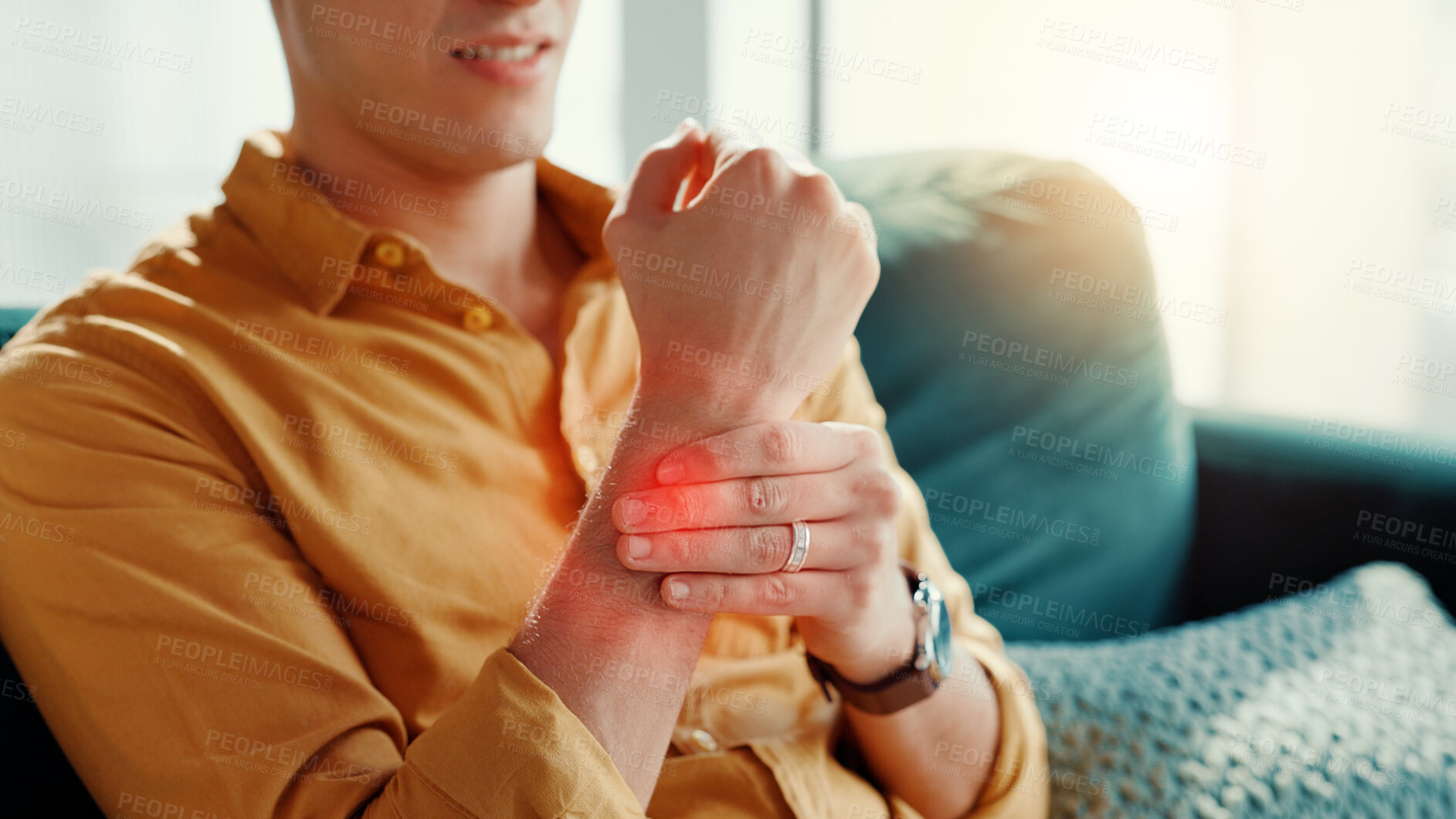 Buy stock photo Home, wrist pain and man on couch, hands or inflammation with stress, arthritis or pressure. Red highlight, closeup or person with muscle tension, mobility or carpal tunnel syndrome with joint injury