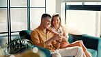 Phone, smile and relax with couple on sofa for social media, streaming and bonding. Happiness, relationship update and love with man and woman in living room of home for communication and online post