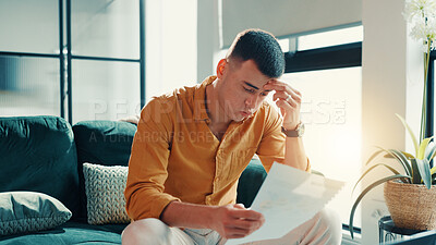 Buy stock photo Stress, man and reading document at house financial crisis, payment notice and debt pressure. Frustrated, male person and paperwork for bank repossession, loan rejection and eviction letter in lounge