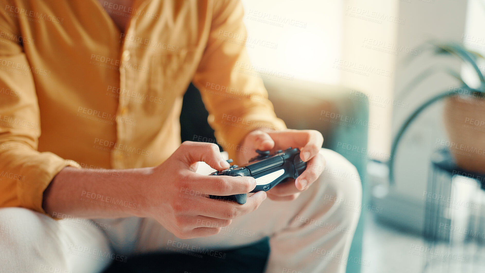 Buy stock photo Playing, games and hands with controller in home, living room and gamer with tech for entertainment. Online, player and person with console for virtual sport, chilling and subscription in apartment