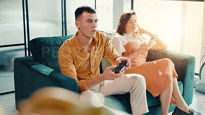 Buy stock photo Concentration, frustrated and gaming with couple on sofa in living room of home for relationship. Annoyed, distraction or ignore with gamer man and woman in apartment for challenge or competition