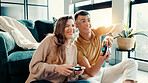 Competition, fun and gaming with couple in living room of home together for bonding or dating. Challenge, remote controller and video game with people in apartment for entertainment or relationship