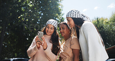 Buy stock photo Phone, keffiyeh and activist with friends in city for protest post, human rights and social justice. Gaza relief, community and online support with women outdoor for genocide awareness and palestine