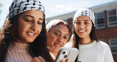 Buy stock photo Phone, keffiyeh and activist with friends in city for protest post, human rights and social justice. Palestine relief, community and online support with women outdoor for genocide awareness and peace