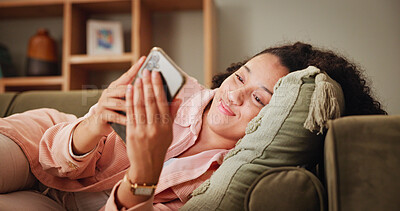 Buy stock photo Woman, relax and smile on sofa for phone, online chat and match on dating website with contact. Home, female person and happiness with mobile for app, friend request and notification on social media