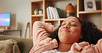 Sofa, woman and arms for stretching to sleep, comfortable and resting with relaxation in apartment. House, female person and smile with daydreaming for peace, chilling and relieved on weekend at home