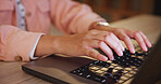 Hands, person and typing on laptop for education, research and studying for university exams. Student, keyboard and online portal for writing thesis, information and scholarship application at house
