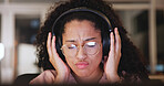 Woman, relax and laptop with headphones at house for listening to music, streaming audio and night. Female person, tech and online podcast, sound connection and subscribe for overtime entertainment
