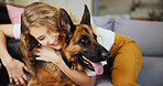 Home, woman and hug for dog, care and affection for german shepherd in living room or rescue animal. Happy, adoption and person with pet in lounge, bonding or love for canine with loyalty in house