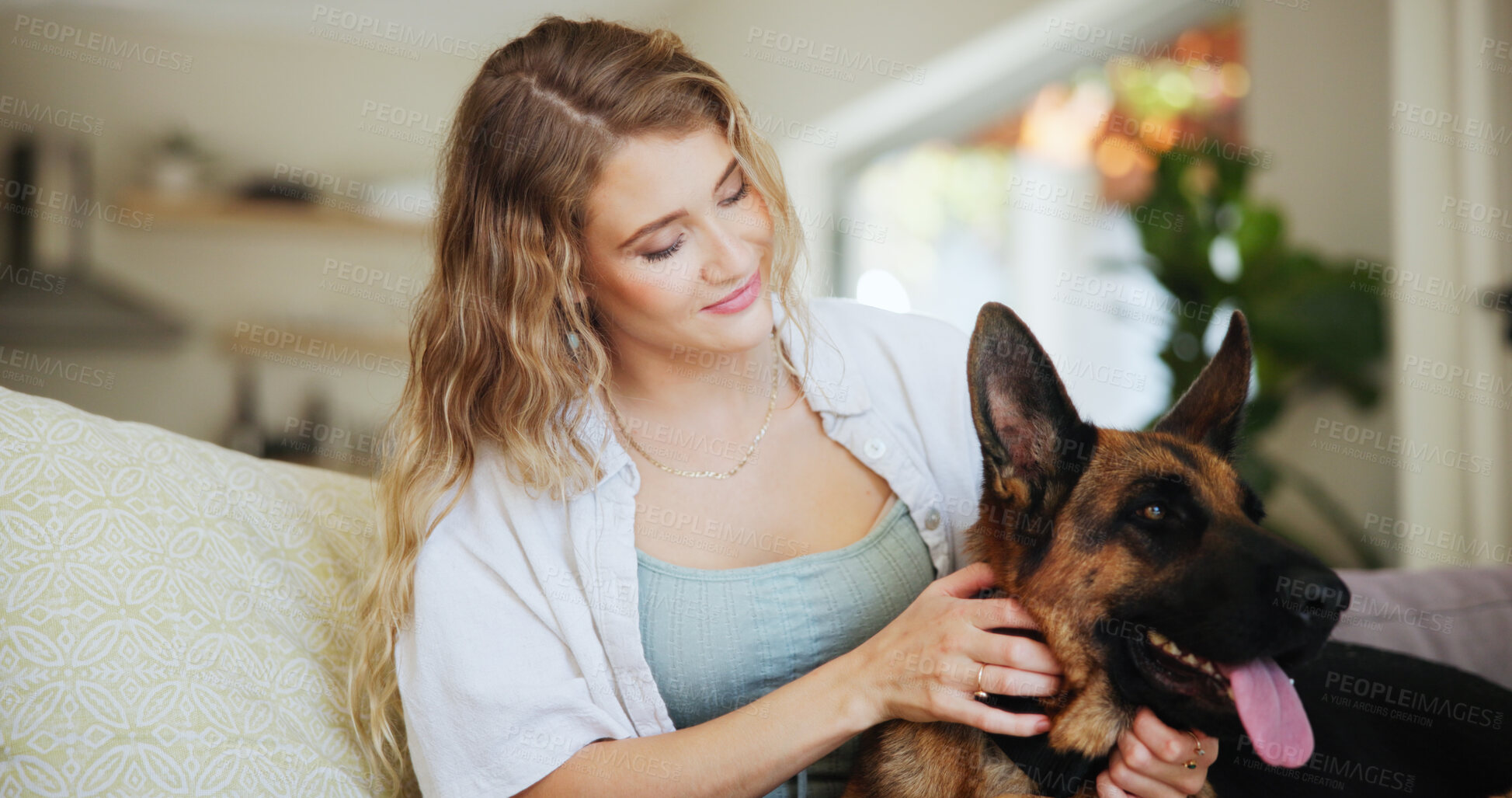Buy stock photo Home, dog and woman on sofa, smile and bonding together with love, kindness and happiness. Apartment, best friends and person on couch, pet owner and affection with weekend break, care and animal