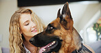 Happy, woman and bonding with dog, home and affection for german shepherd in living room and canine. Smile, owner and person with rescue animal in lounge, love and care for companion with loyalty