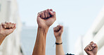 Power, group or people with fist in city for inflation, human rights or cost of living. Stop, lower prices or hands in air for community protest, rally, social justice for higher wages for change