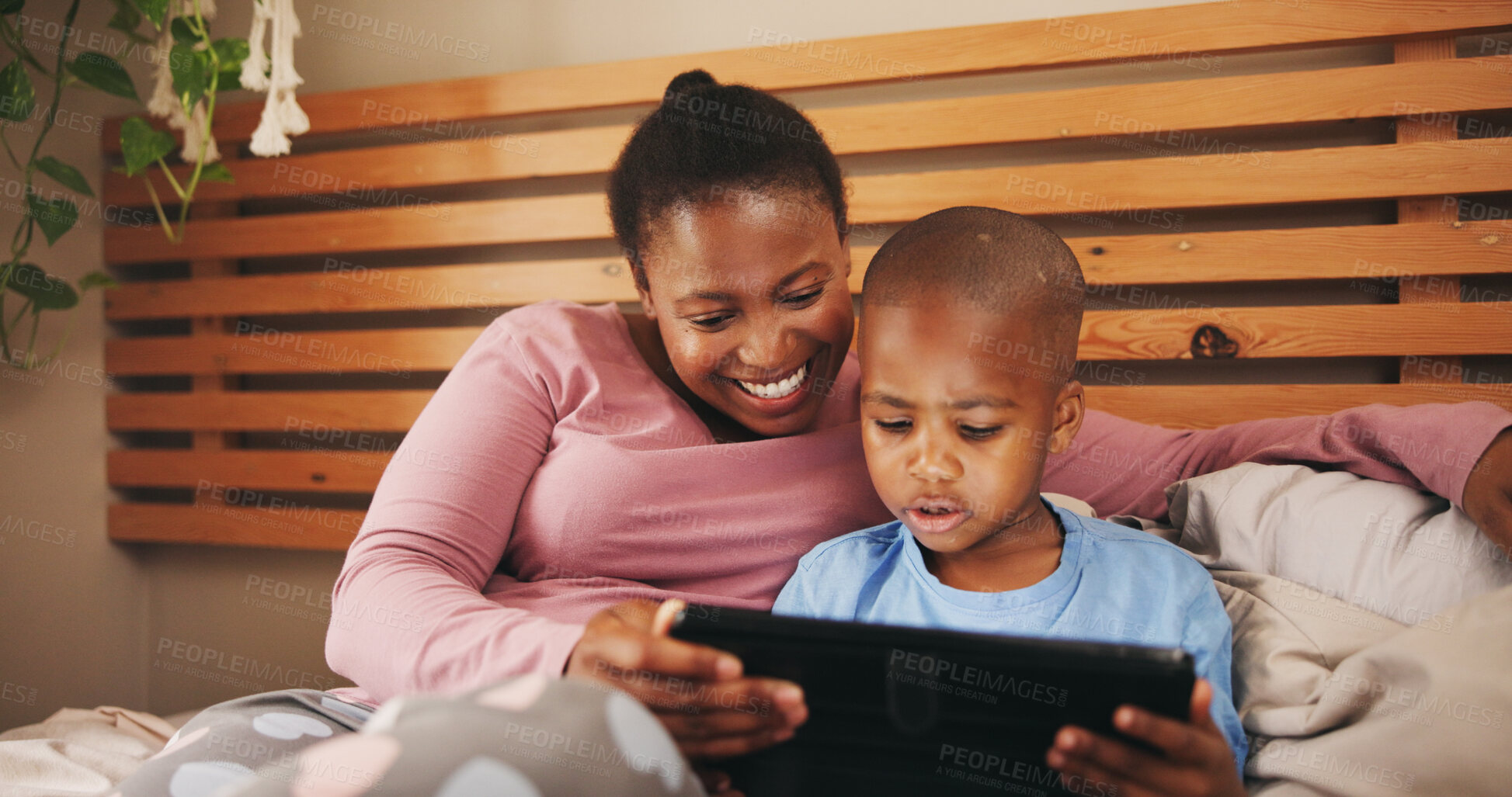 Buy stock photo Relax, tablet and black mother with child in bed for bonding with watching movie, video or film. Happy, morning and African mom with kid on digital technology for streaming series together in home.