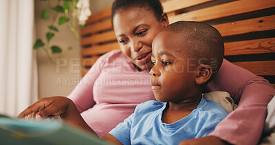 Buy stock photo Home, reading book and mother with boy, smile and bonding together with hobby. African family, mama and son with happiness, learning and child development with knowledge, literacy and storytelling
