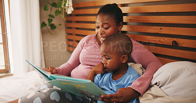 Buy stock photo Home, reading book and mother with boy, bedroom and bonding together with knowledge. African family, mama and son with storytelling, learning and child development with hobby, literacy and help